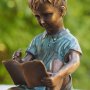 Pronssinen patsas "Boy Drawing In Book"